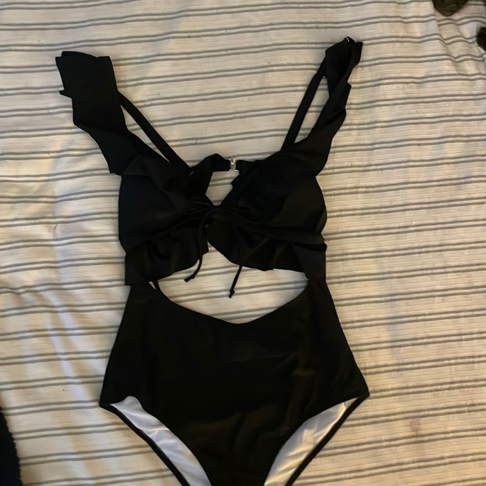 NWOT Black one piece women’s swimsuit.